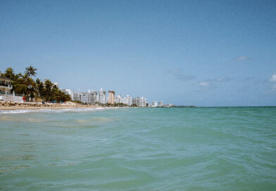The turquoise waters of Ocean Park beach in Puerto Rico on a summer day.